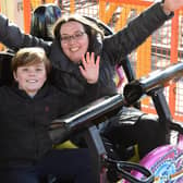 Kim Mills and Joseph Mills, 10, of Lemmington Spa on the new Spinning Racer at Fantasy Island in Ingoldmells. Kim said: 'It was really exciting and an adrenaline rush'.