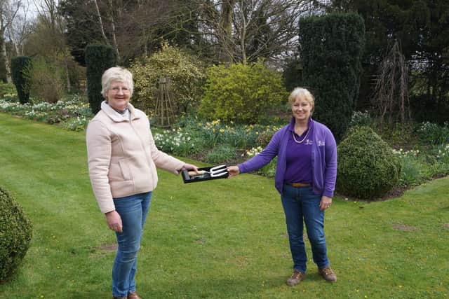 Debbie Hollingworth, right, was presented with the commemorative fork by NGS organiser for Lincolnshire, Helen Boothman EMN-210413-080327001