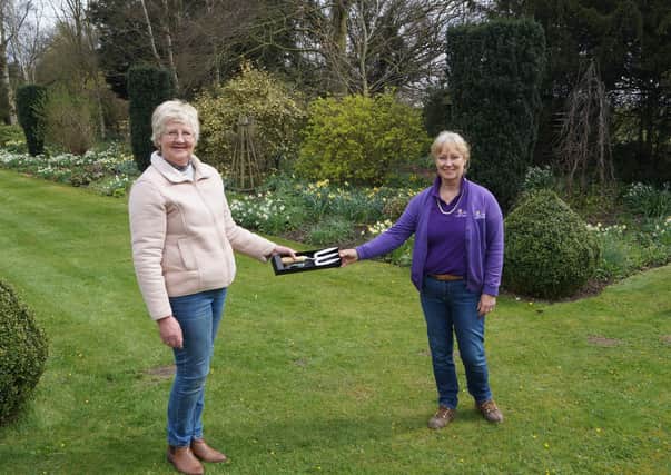 Debbie Hollingworth, right, was presented with the commemorative fork by NGS organiser for Lincolnshire, Helen Boothman EMN-210413-080327001