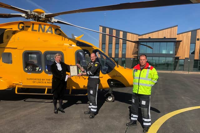 The High Sheriff of Lincolnshire, Michael Scott, presented the award to chief pilot Llewis Ingamells