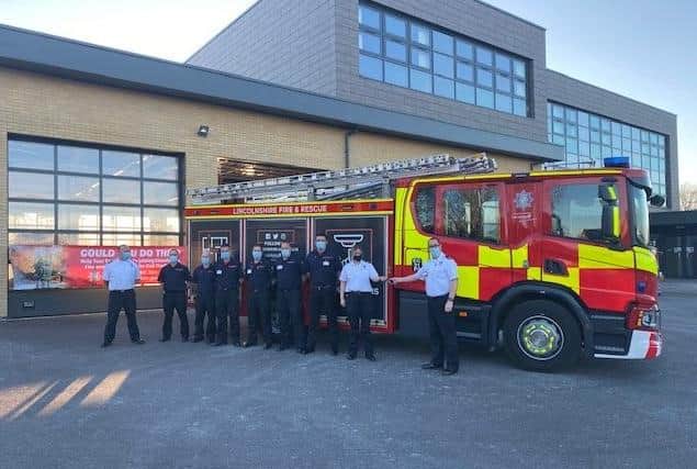 Sleafords part-time 'on-call' firefighting crew saw their new fire appliance arrive on Thursday as part of an ?8m investment in new kit across the county. Pictured are Group Manager Matthew Perrin handing over the keys to Watch Manager Kerry Raynor with some of the on-call crew. EMN-210416-164756001