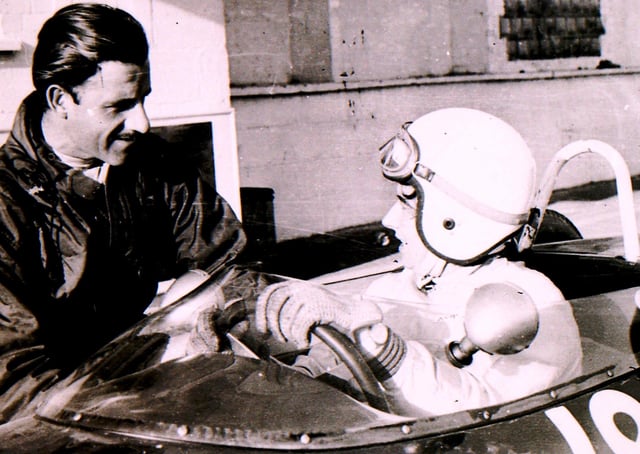 Formula 1 world champion Graham Hill shares a few racing tips at the Folkingham test site back in the sixties. EMN-210416-151006001