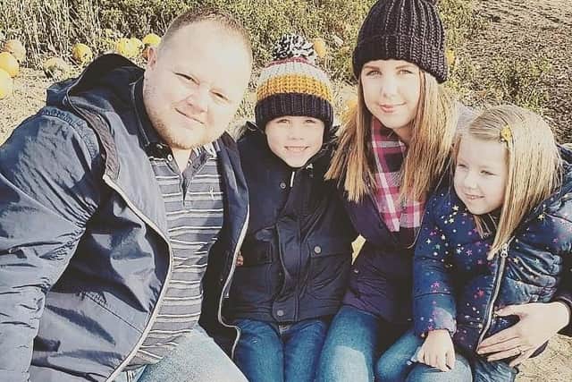 Reiko pictured in Skegness with parents Chris and Jade Woods and her sister.