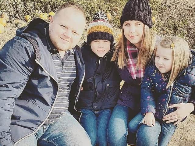 Reiko pictured in Skegness with parents Chris and Jade Woods and her sister.