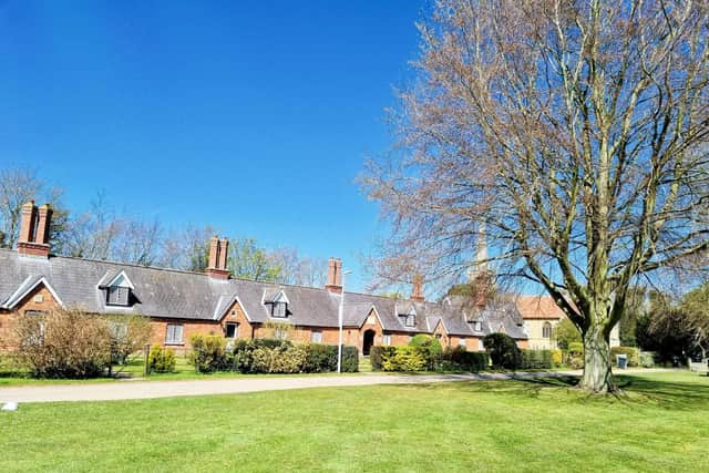 Revesby Almshouses look out over the village green.