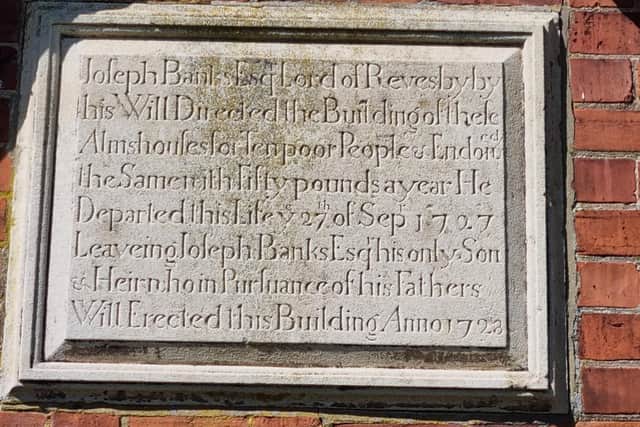 A plaque telling the history of the Revesby Almshouses.
