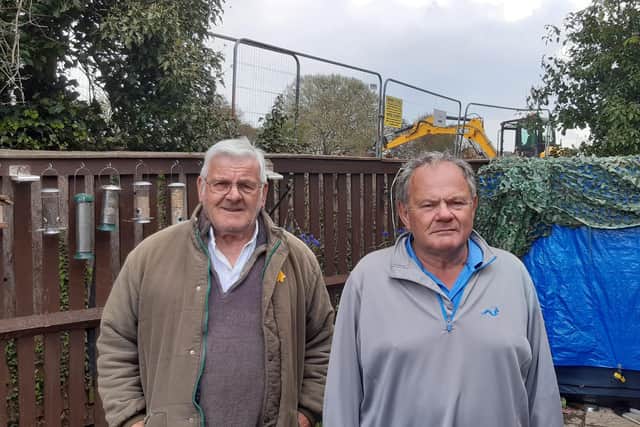 Spriggs Close residents John Armstrong (Left) and Peter Cole. Unhappy about the housing development behind their homes. EMN-210429-124256001
