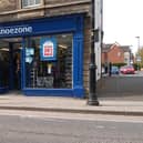 Closing down signs across the windows of the Sleaford branch of Shoe Zone. EMN-210428-164411001
