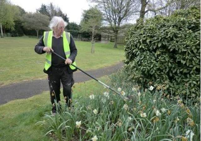 Councillor Burbidge volunteering in Hamerton Gardens