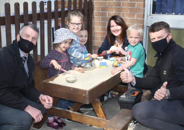Lindum Group managers and Heckington Pre-School Manager Sue Berry see children enjoying their new sandpit. EMN-210505-173501001