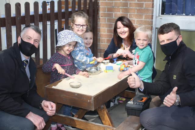 Lindum Group managers and Heckington Pre-School Manager Sue Berry see children enjoying their new sandpit. EMN-210505-173501001