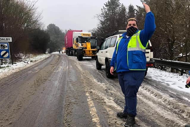 Lincolnshire Community Assistance Team Responder P.J.Harwood directing traffic at an incident of a jack-knifed lorry on the A16 at Dolby Hill at the request Lincolnshire Police.