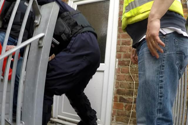 Police raiding one of the properties