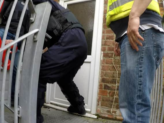 Police raiding one of the properties