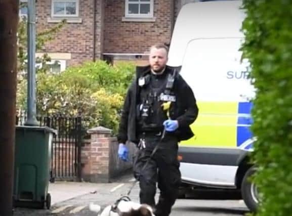 A police dog handler during the operations