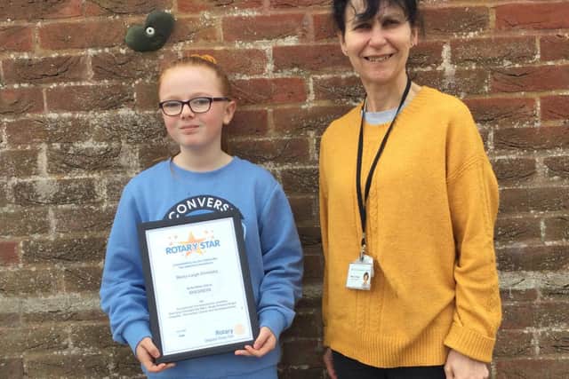 Year 5 Teacher Mrs Sarah O’Dare and Maisy with her award.