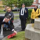Tony Kelly, committee member of the Royal British Legion in Skegness, lays a wreath at the memorial at St Matthew's Church.