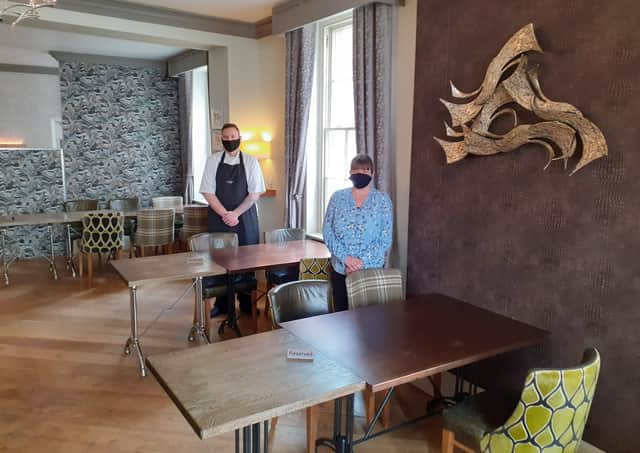 Advocate Arms chef Josh Kelley and manager Katie Pywell were ready to welcome back customers Inset above: Ann and Tony Lumb were pleased to be back among people and tucking into lunch at The Aston Arms EMN-210518-123010001