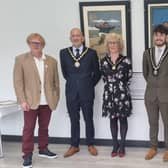 John Byford (left) and Janice Sutton (right) in front of the renovated original Jolly Fisherman paintings, with the Mayor and Mayoress of Skegness, Coun Trevor Burnham and his wife, Jane, at the Tower Gardens Pavilion in Skegness.