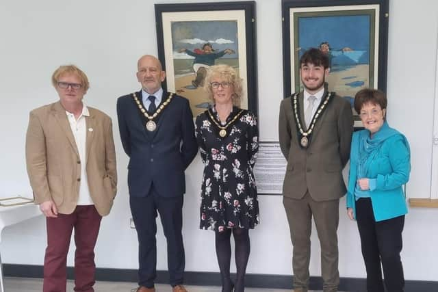 John Byford (left) and Janice Sutton (right) in front of the renovated original Jolly Fisherman paintings, with the Mayor and Mayoress of Skegness, Coun Trevor Burnham and his wife, Jane, at the Tower Gardens Pavilion in Skegness.