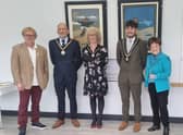 John Byford (left) and Janice Sutton (right) in front of the renovated original Jolly Fisherman paintings, with the Mayor and Mayoress of Skegness, Coun Trevor Burnham and his wife, Jane, at the Tower Gardens Pavilion in Skegness.