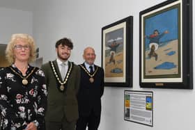 Skegness Mayoress Jane Byford, Deputy Mayor Coun Billy Brookes and Mayor Coun Trevor Burnham at the unveiling of original renovated Jolly Fisherman paintings in Skegness.