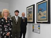 The unveiling of the original paintings of the Jolly Fisherman by Mayor of Skegness Coun John Byford, with Mayoress Jane Byford and Deputy Mayor Coun Billy Brookes.