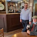 Cheers! White Swan landlord Martin Scoot with Les Tranter EMN-210518-104501001