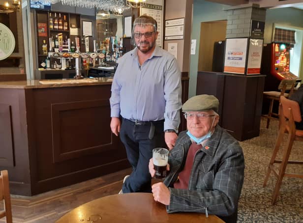 Cheers! White Swan landlord Martin Scoot with Les Tranter EMN-210518-104501001