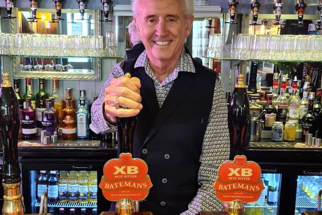 Singing legend Tony Christie, who Jan and Paul manage, pours one of the first pints at The Carps