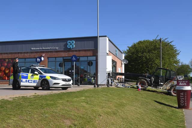 Police are still on the scene of the ram raid at Ancaster Co-op. EMN-210519-095308001