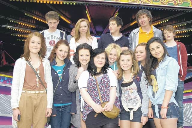 Sleaford teens by the waltzer at the fair.