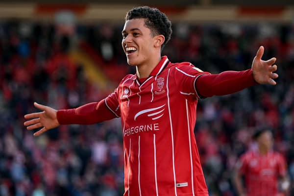 Brennan Johnson of Lincoln City celebrates after scoring their sides second goal. (Photo by Laurence Griffiths/Getty Images)