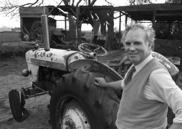 Fishtoft Farmer Roy Bolland and his 'self-drive' tractor pictured near the gutted shed.