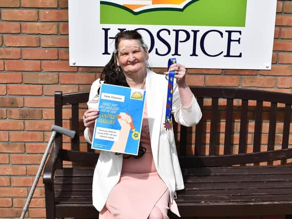 Hospice Hero Pattie Chapman is pictured with her hero medal.