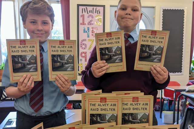 Pupils with The Alvey Air Raid Shelter leaflets.