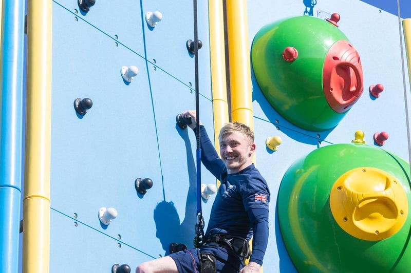 Olympic gymnast Nile Wilson on a climbing wall.