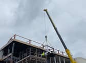 A £350,000 Lamborghini is hoisted into the new Supercar VIP Lounge at the Hive in Skegness.