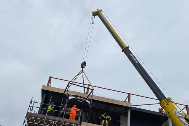 A £350,000 Lamborghini is hoisted into the new Supercar VIP Lounge at the Hive in Skegness.