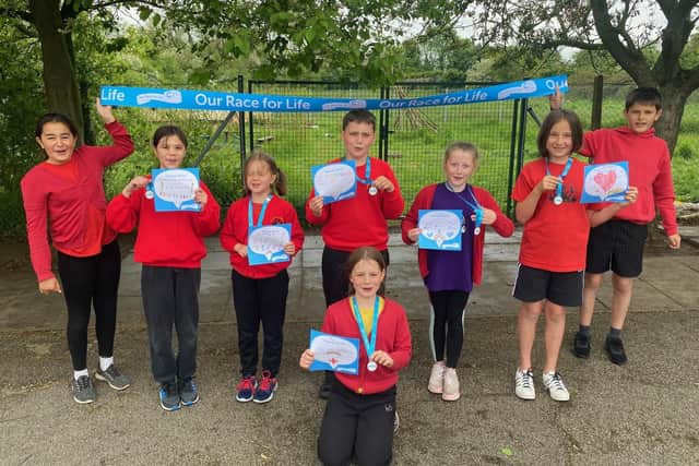 Pupils at St Andrew's School, Leasingham ran the Race For Life. EMN-210527-164423001