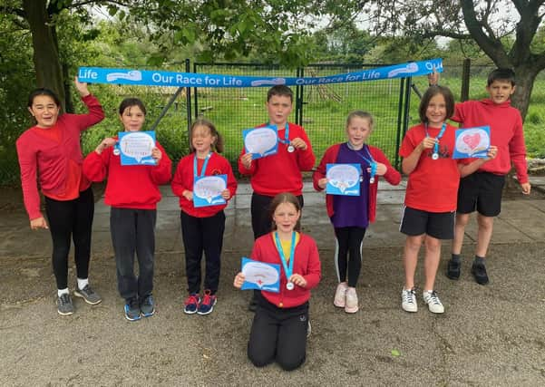 Pupils at St Andrew's School, Leasingham ran the Race For Life. EMN-210527-164423001