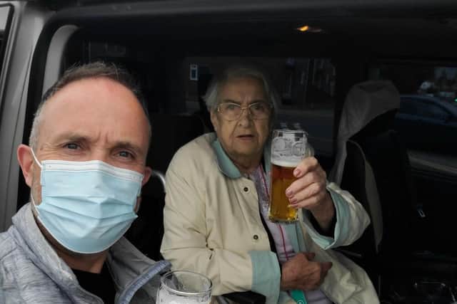 Cheers - Christopher Sweeny, managing director of Syne Hills, enjoying a 'half' with Doreen.