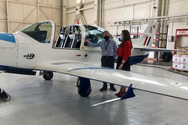 Affinity Managing Director Iain Chalmers shows Dr Caroline Johnson MP a Grob 120 TP Prefect. Photo: Affinity Flying Training Services May 2021. EMN-210528-172359001