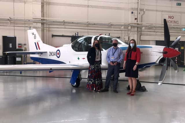 From left - Alex Davison, Affinity Business Operations Director; Affinity Managing Director Iain Chalmers and Dr Caroline Johnson MP. Photo: Affinity Flying Training Services May 2021. EMN-210528-172410001