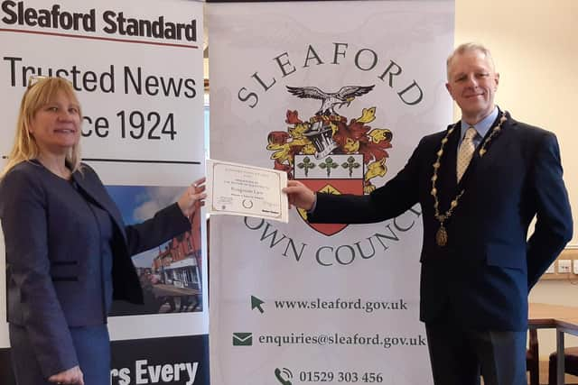 Julie Atkinson of Ringrose Law receives the Mayor's Special Award from Deputy Mayor at the time, Robert Oates. EMN-210528-143325001