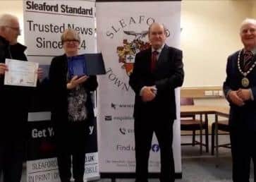 From left - Bob Stanley and Amy Scotney of Sleaford Be Litter Free receive the Community Award from sponsor Graham Arnold, chairman of governors of St George's Academy, with Mayor Anthony Brand. EMN-210528-151250001