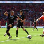 Blackpool's Elliot Embleton shoots whilst under pressure from Max Sanders. (Photo by Catherine Ivill/Getty Images)