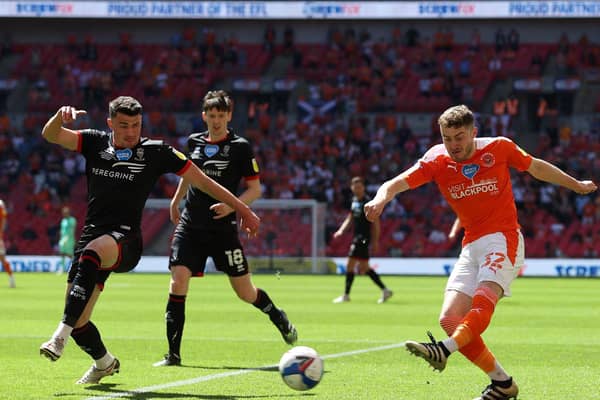 Blackpool's Elliot Embleton shoots whilst under pressure from Max Sanders. (Photo by Catherine Ivill/Getty Images)