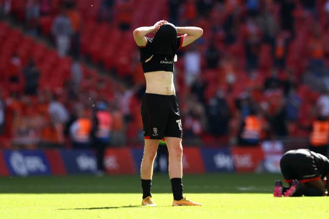 Callum Morton of Lincoln City looks dejected after the Sky Bet League One Play-off Final match between Blackpool and Lincoln City at Wembley Stadium. (Photo by Catherine Ivill/Getty Images)