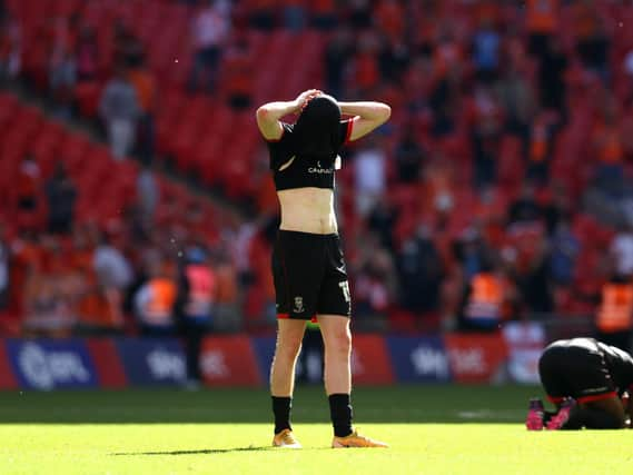 Callum Morton of Lincoln City looks dejected after the Sky Bet League One Play-off Final match between Blackpool and Lincoln City at Wembley Stadium. (Photo by Catherine Ivill/Getty Images)